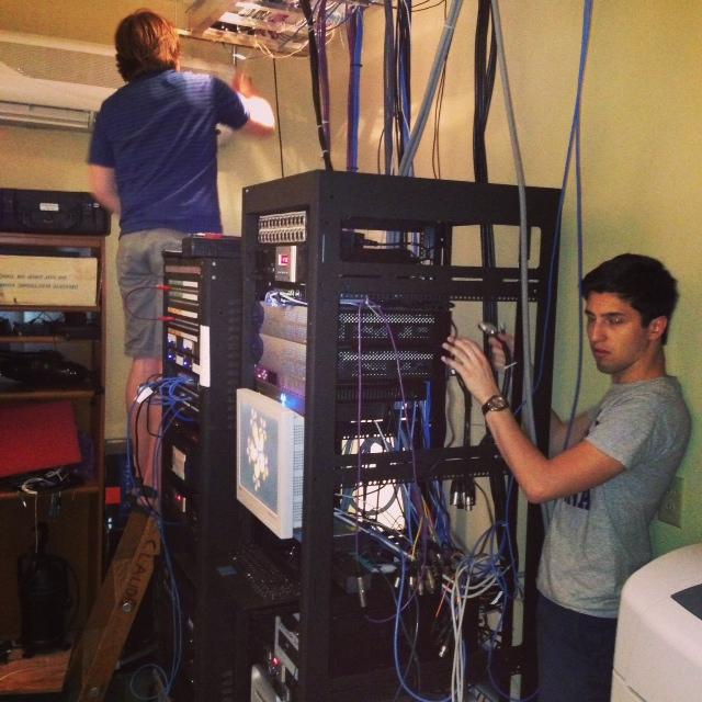 Joey Diehl and Jordan Bailey working to pull out the old AES cables